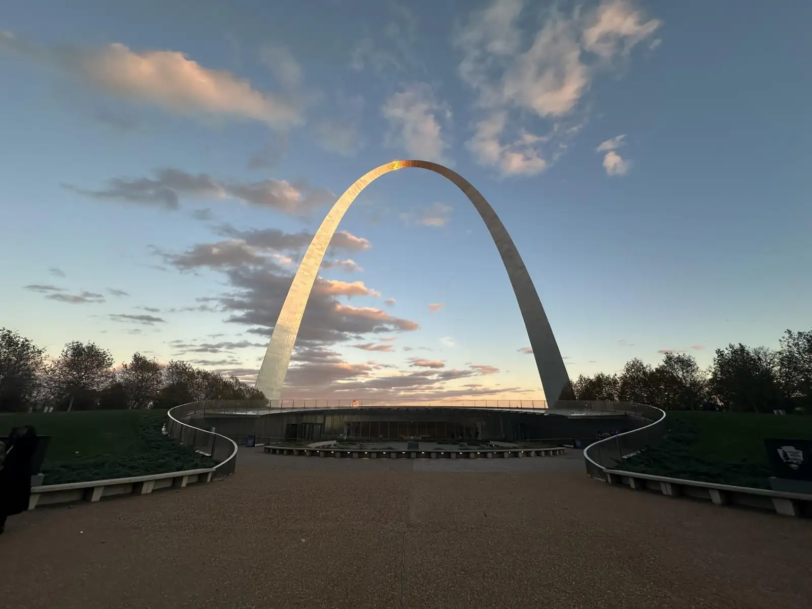 The Gateway Arch against clouds in a blue sky