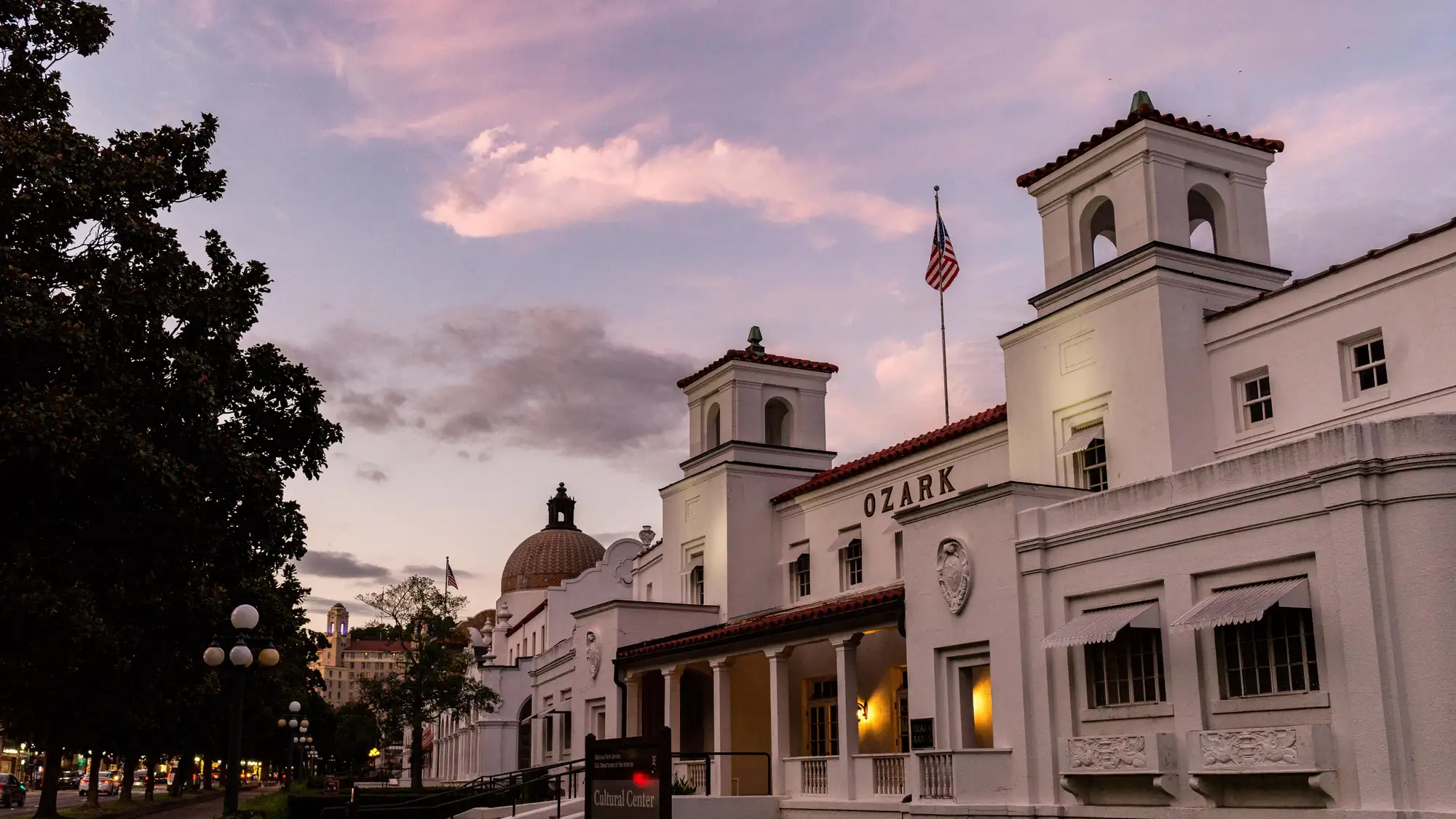 A pink sky above gentle white buildings